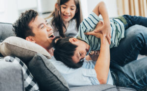 Family having fun tickling each other